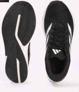 Man wearing Adidas Duramo RC U shoes outdoors during walk